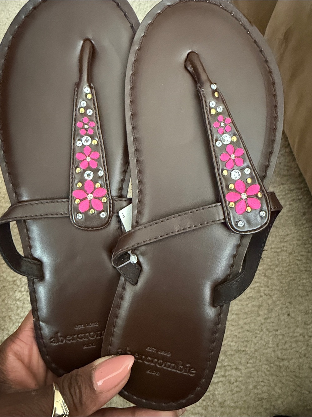 Brown sandals with pink flowers
